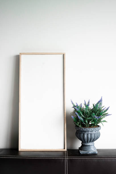 istock Blank picture frame and fake tree, copy space for text. 1279147179