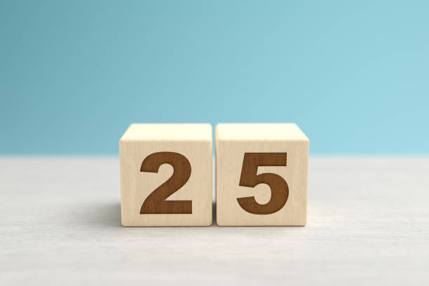 istock Wooden toy blocks forming the number 25. 1279149669