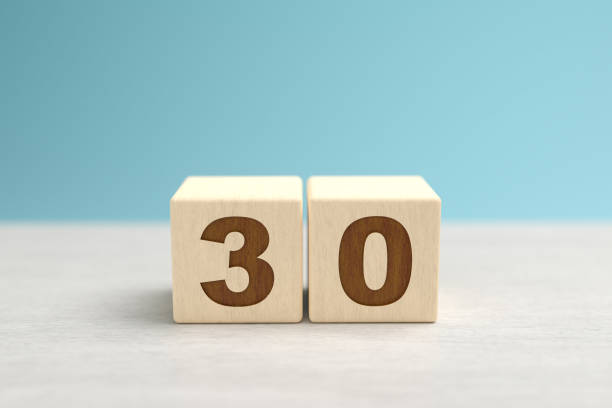 istock Wooden toy blocks forming the number 30. 1279149679