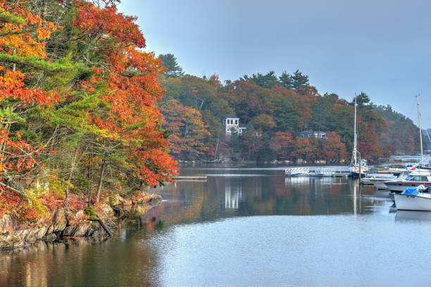 istock Beautiful Fall colors with reflection-Dock and boats-Booth Bay Harbor Maine 1279149981