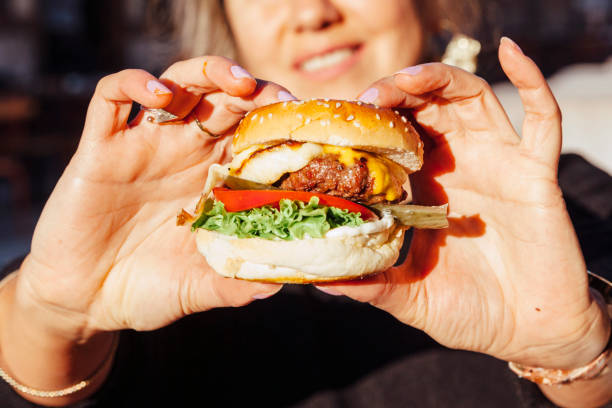 istock Young women holding Beef Burger 1279151794