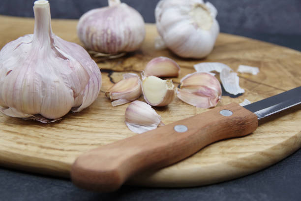 istock Fresh garlic cloves and garlic bulb 1279152965