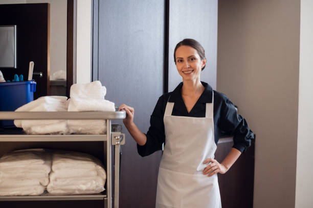 A member of a hotel service staff doing her job stock photo
