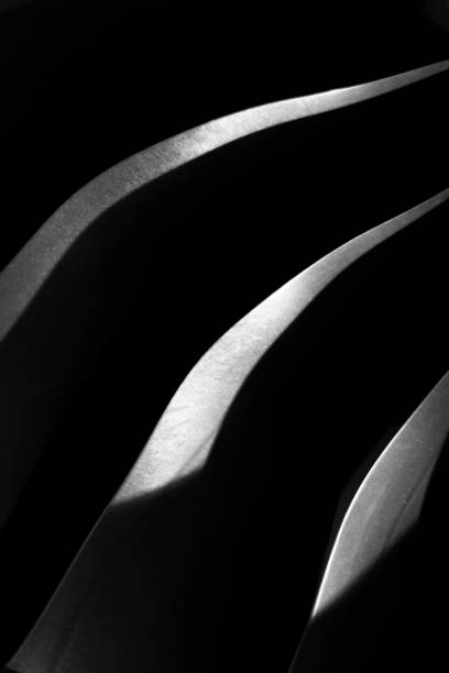 istock Light on steel blades in the dark 1279154974