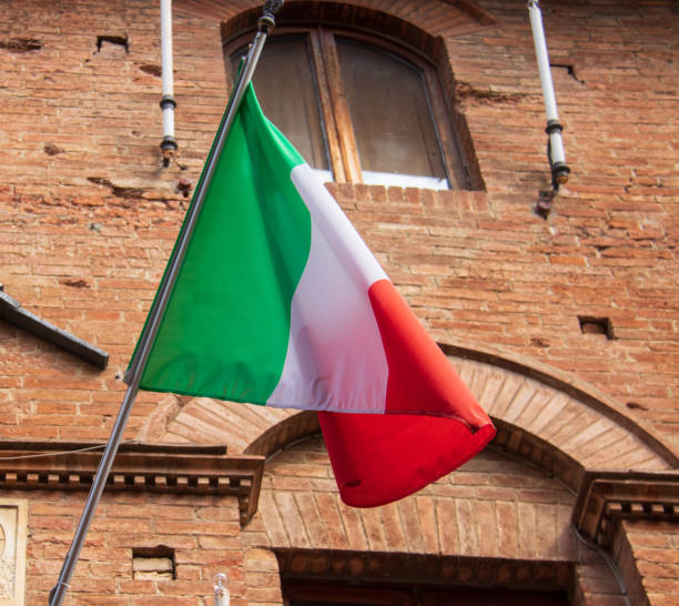 istock Italian flag on a old wall 1279156050