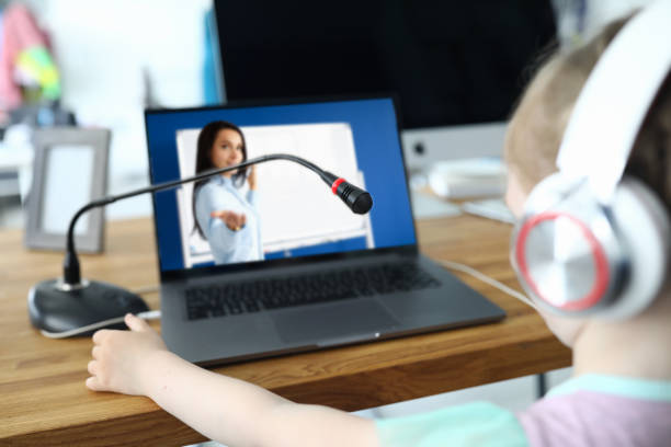 istock Little kid communicates online with teacher 1279156315