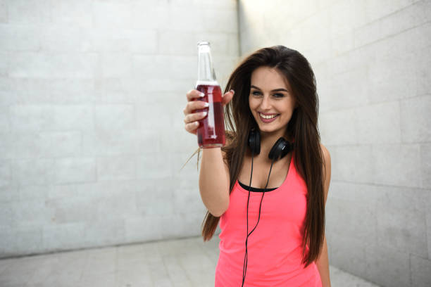 istock Young happy, beautiful woman enjoying refreshment 1279157316