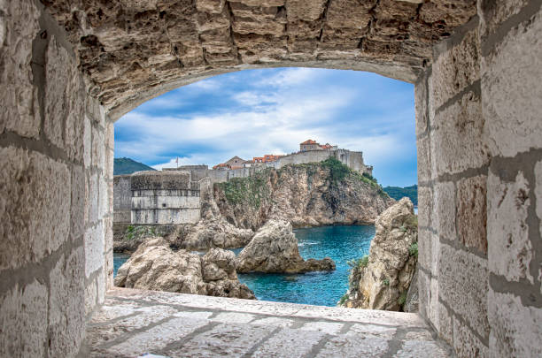 istock View from stone window of cliffs, sea and Dubrovnik historic wall 1279160960