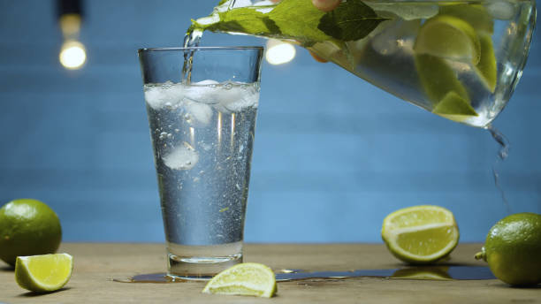 istock Pouring lemonade into a glass 1279163224