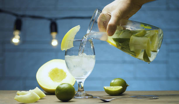 istock Pouring melon lemonade into a glass 1279163395