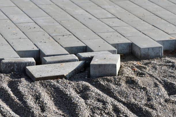 istock Laying gray concrete paving slabs 1279165925