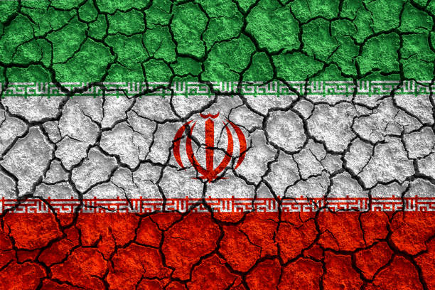 istock The Iranian flag painted on cracked ground with vignette 1279169036