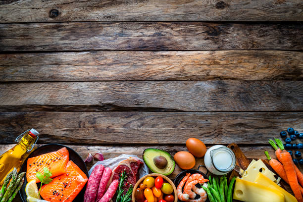 istock Food border on wooden table. Copy space 1279169902