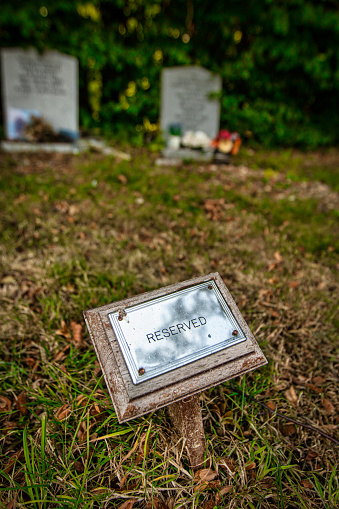 Reserved grave plot plaque in a graveyard