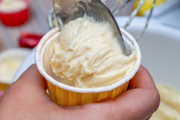 istock Cooking cupcake muffin raw dough in a form 1279171236