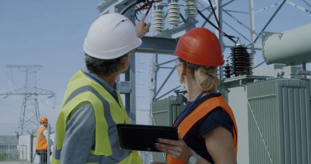 istock Mature engineers examining data and power station equipment 1279171341