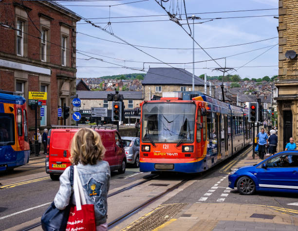 Tram arriving at passenger stop in Sheffield, Yorkshire, UK on 18 May 2018