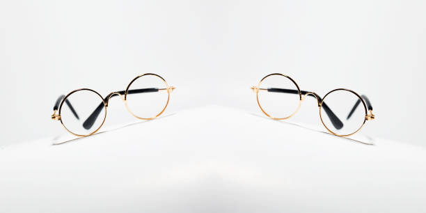 istock Symmetrical reflection of round eyeglasses on white background. 1279176024