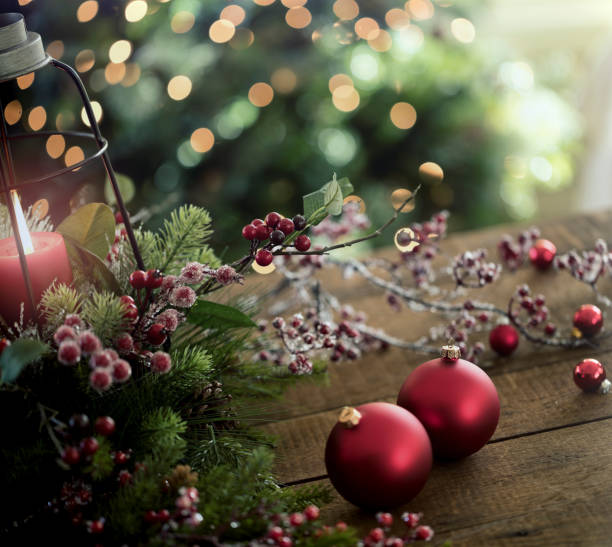 istock Christmas Baubles and a Lantern in front of a Christmas Tree 1279176140