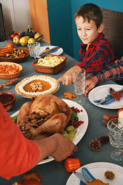 istock Family Having Traditional Holiday Stuffed Turkey Dinner 1279176630
