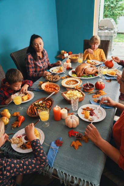 istock Family Having Traditional Holiday Stuffed Turkey Dinner 1279177333
