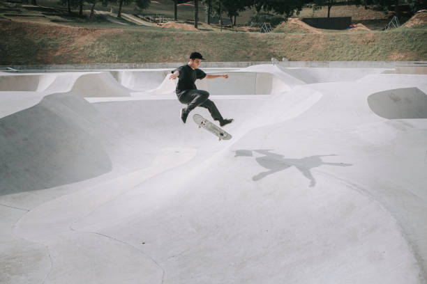 istock Asian skateboarder in action falling down failing 1279179985