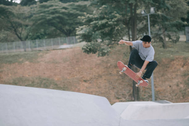 istock Asian skateboarder in action mid air x games 1279180041