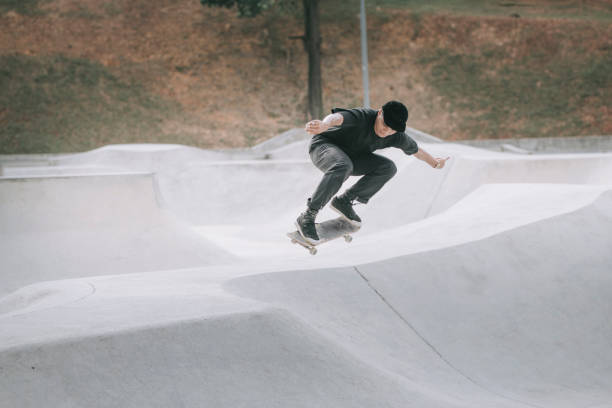 istock Asian skateboarder in action mid air x games 1279180042