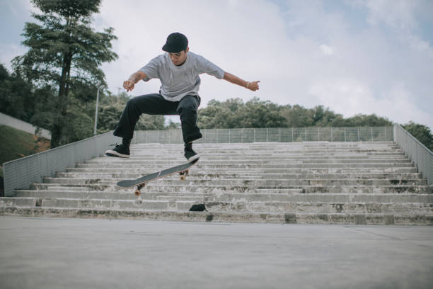 istock Asian skateboarder in action mid air x games 1279180055