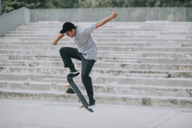 istock Asian skateboarder in action mid air x games 1279180067