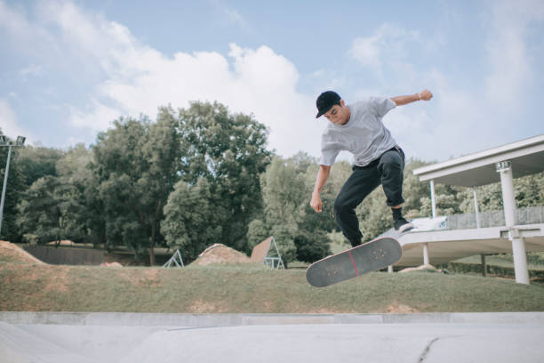 istock Asian skateboarder in action falling down failing 1279180077