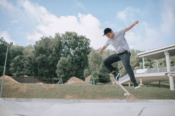 istock Asian skateboarder in action falling down failing 1279180097
