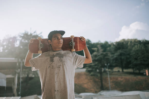 skateboarder jumping with board. hand and legs are motion blurred