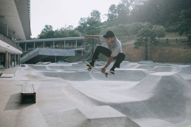 istock Asian skateboarder in action mid air x games 1279180145
