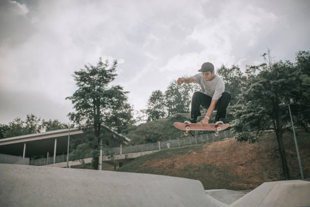 istock Asian skateboarder in action mid air x games 1279180242