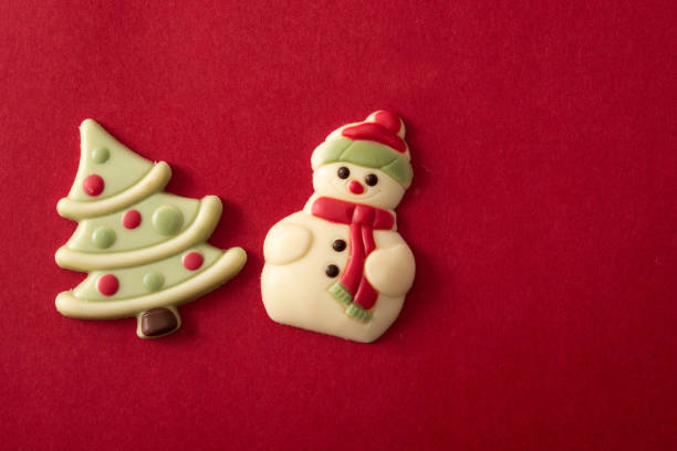 Christmas bonbons on red background