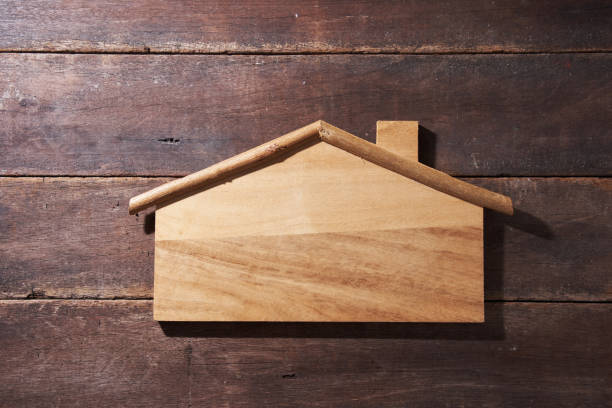 istock house shape message board on wood background 1279182976
