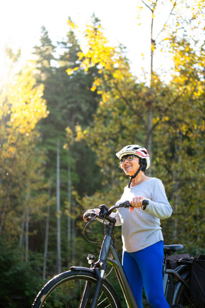 istock Senior woman riding an e-bike 1279183623