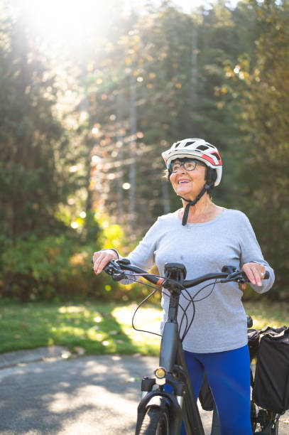 istock Senior woman riding an e-bike 1279183699