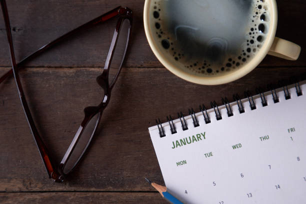 istock 2021 calendar with cup of black coffee 1279184635