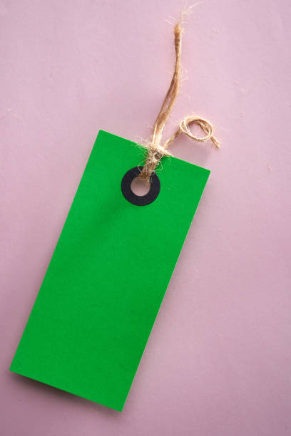 green color price tag on pink background