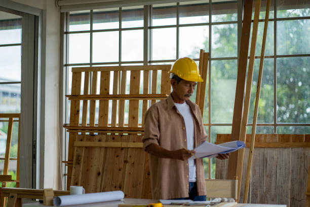 istock senior Asian carpenter working and recording DIY home improvement wood work 1279184723