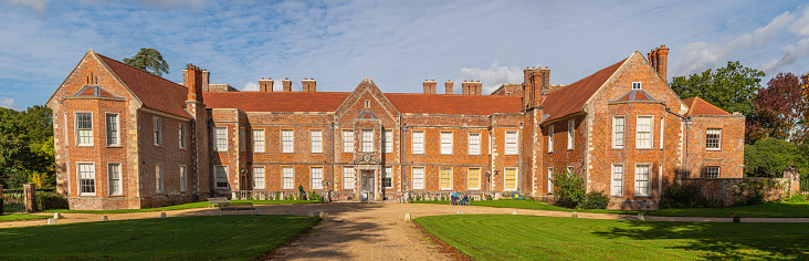 Panorama of The Vyne and drive leading to the front on a sunny day this victorian family home formerly was a powerhouse. Basingstoke, Hampshire, England.