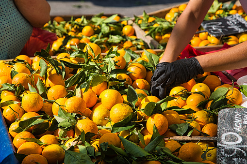 Summer village marketplace with oranges in Greece.