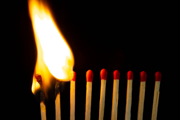 istock Group of red match burning isolated on black background. 1279186047