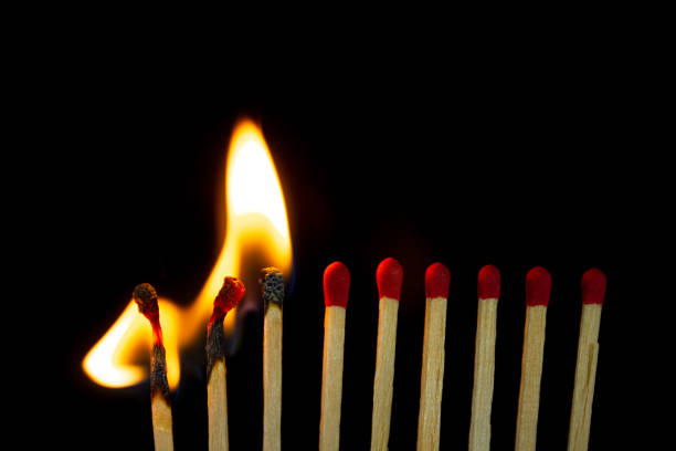 istock Group of red match burning isolated on black background. 1279186157