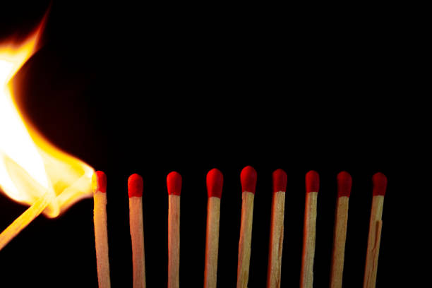 istock Group of red match burning isolated on black background. 1279186281