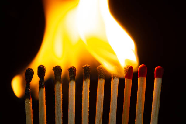 istock Group of red match burning isolated on black background. 1279186338