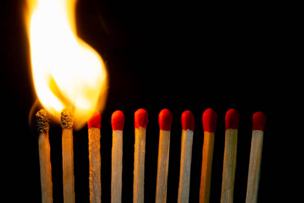 istock Group of red match burning isolated on black background. 1279186355
