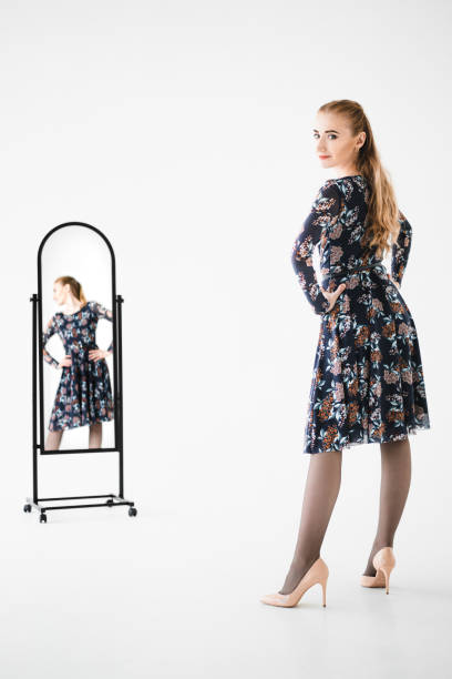 istock A young woman model next to the mirror. 1279186446